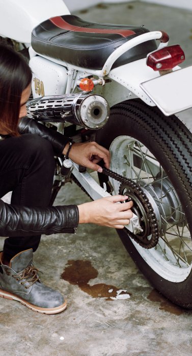 top-angle-view-biker-repairing-his-bike